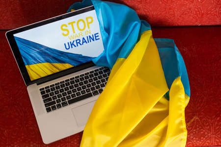 No war message on laptop. Ukraine vs Russia, conflict, cyber attack, invasion, army soldier. Hope for peace.の写真素材
