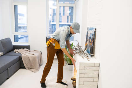 building master examines a new fireplace.の写真素材