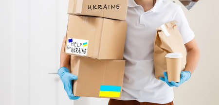 Humanitarian aid to Ukraine because of the war, Charity and assistance to people in need, refugee supportの写真素材