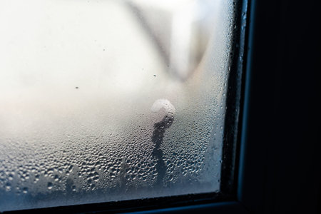 Wet window after autumn or winter rain