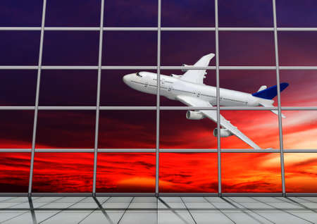 Silhouette of an airplane in the sky against the background of the sun.の写真素材
