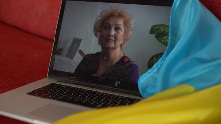woman, the news about Ukraine on laptop. Close up, copy space, background.