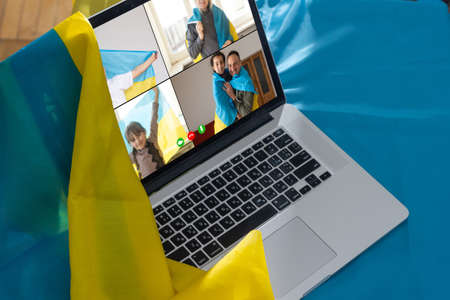 flag of ukraine, young woman teacher working with laptop sitting in classroom. Education, school college universityの写真素材