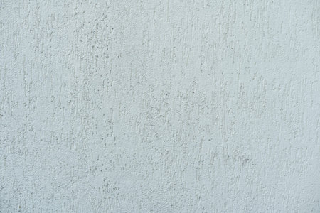 Pattern of light beige decorative and textured plaster. Construction and finishing materials for...
