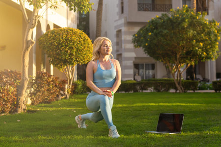 girl practice yoga outdoor. Healthy lifestyle. Woman wear sportswear in yard of resort hotel