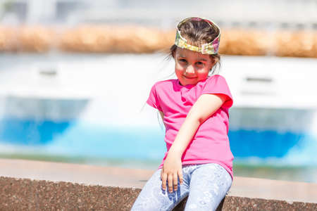 Cute little girl in amusement parkの写真素材