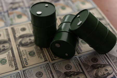 the barrel of oil of one hundred US dollar billsの写真素材