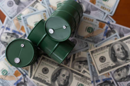 Barrel of crude oil with dollar bills. Close up. Business concept.の写真素材