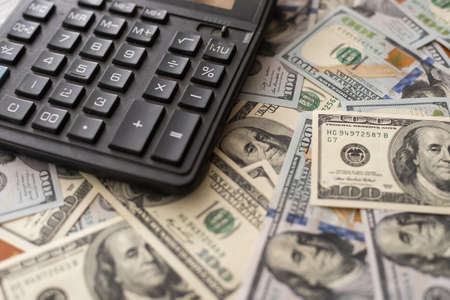 one hundred dollar bills calculatorの写真素材