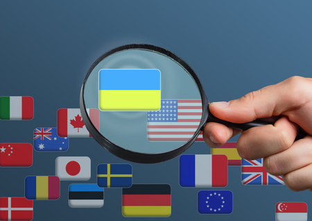 Hand pushing on a touch screen interface, choosing Ukraine. flags of the world
