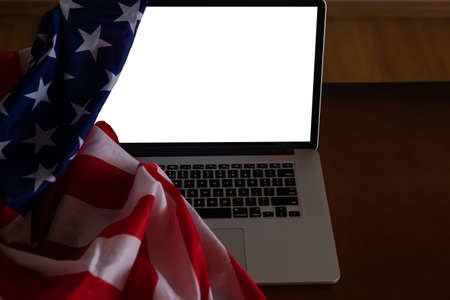 Laptop with USA flag, screen Isolated on white backgroundの写真素材