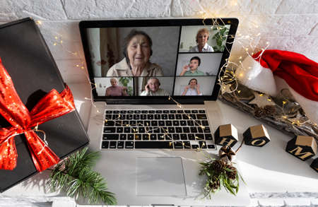 Remote Christmas video party. Family call celebrate New Year 2023 Online video conferencing. Virtual meeting conference calling from homeの写真素材