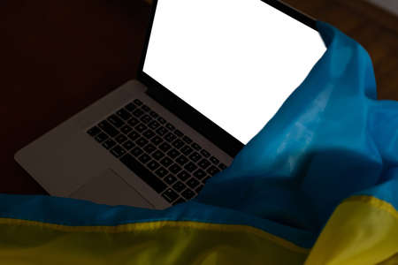 laptop with blank screen, flag of ukraine.の写真素材
