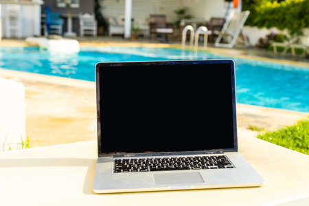 computer on table background as a pool.の写真素材
