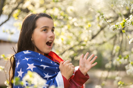 little girl with usa flagの写真素材