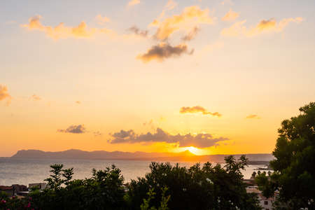 Evening sky with dramatic clouds over the sea. Dramatic sunset over the sea.の写真素材