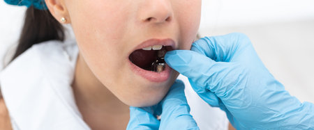 Little girl sitting in the dentists officeの写真素材