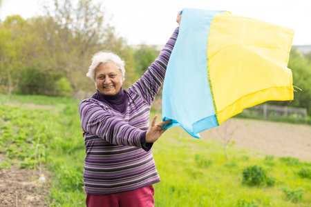 elderly woman with the flag of ukraine