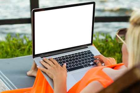 Young women working on her laptop with blank copy space screen for your advertising text message,...