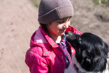poor little girl with a dog in village