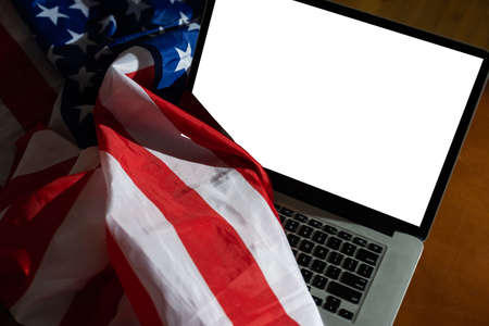 Laptop with USA flag, screen Isolated on white backgroundの写真素材