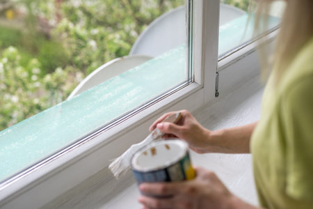 hand painting the window frame