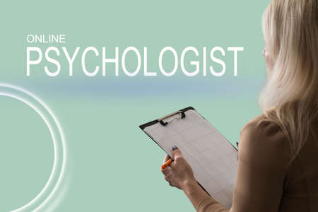 female psychologist with clipboard in therapyの写真素材