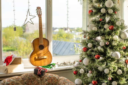 guitar with Christmas presents. Concept image for holiday musical event.の写真素材