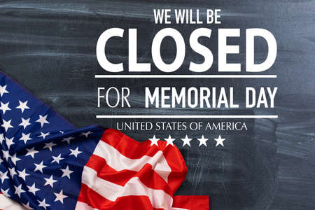 Veterans Day closed message with red, white and blue stars on burlap on a weathered whitewash wood.の写真素材