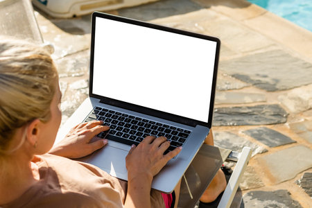 computer screen blank mockup. hand work using laptop with white background for advertising, contact...