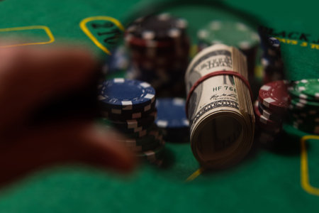 poker chips, magnifying glass on blackjack table