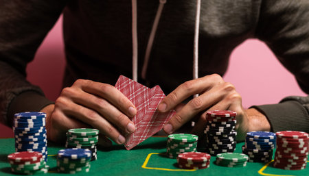 man playing blackjack at the table and betting chips