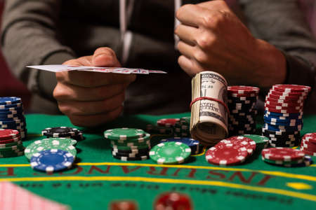 Man playing BlackJack at the casinoの写真素材