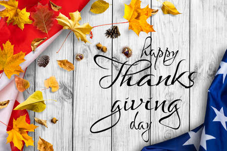 Happy Thanksgiving. USA American flag. Fall decor with autumn leaves. Banner design, panoramic image, text.の写真素材