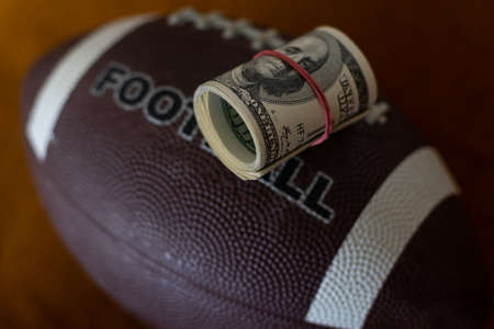 rugby ball and dollars, businessの写真素材