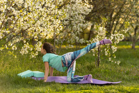 child doing gymnastics exercises. Sports, learning, fitness, stretchingの写真素材