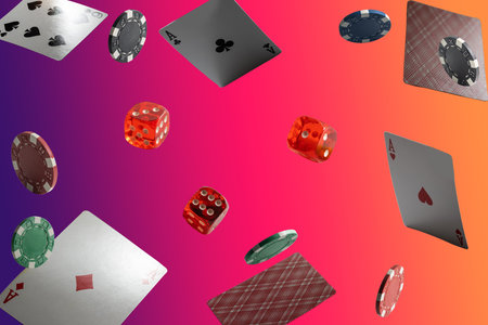The concept of chips and cards for playing poker on the background of a flying cards