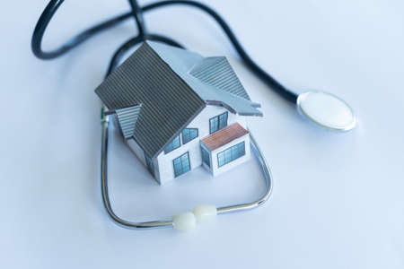 House check. miniature house and stethoscopeの写真素材
