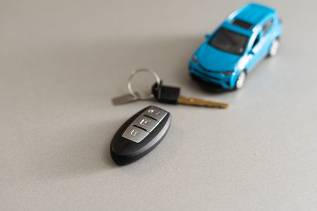little car and keys on a wooden table