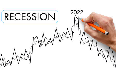 Crisis 2022. Quarterly or annual report of companies. Economic recession on the chart. Chart arrow pointing down against falling chart and dollar symbolの写真素材