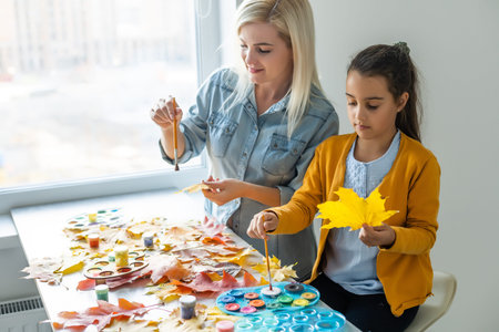 Happy family doing autumn decor. Fall atmosphereの写真素材