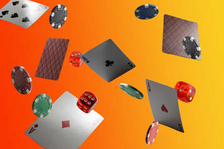 The concept of chips and cards for playing poker on the background of a flying cardsの写真素材