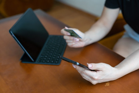 E-commerce concept. Woman with credit card, laptop, close up