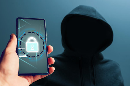 man in a hood Hacker, smartphone with a lock