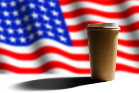 Closeup of American flag with coffee paper cup.の写真素材
