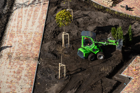 Excavator during earthmoving at construction site. Construction machinery for excavating. Tower...