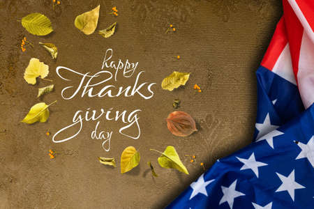 Happy Thanksgiving. USA American flag. Fall decor with autumn leaves. Banner design, panoramic image, text.の写真素材