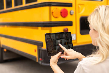 Online communication, consultation, training, business. Woman teacher, mentor, psychologist looking at webcam of tablet, talking, counseling. Technology distance lifestyleの写真素材
