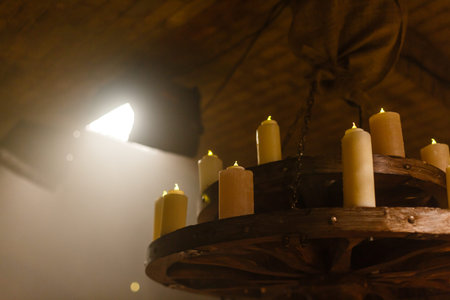 White glowing lanterns with delicate design on table in an old house.