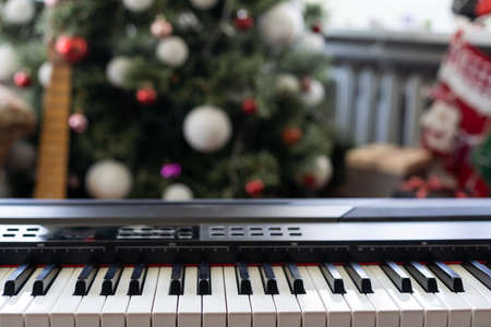 Christmas ball on piano keys. Carol music conceptの写真素材